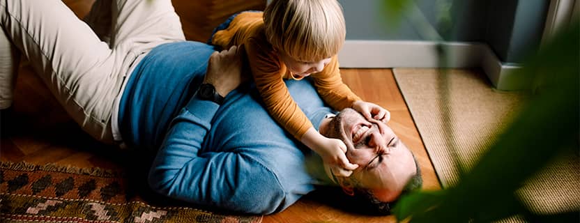 Child playing with dad